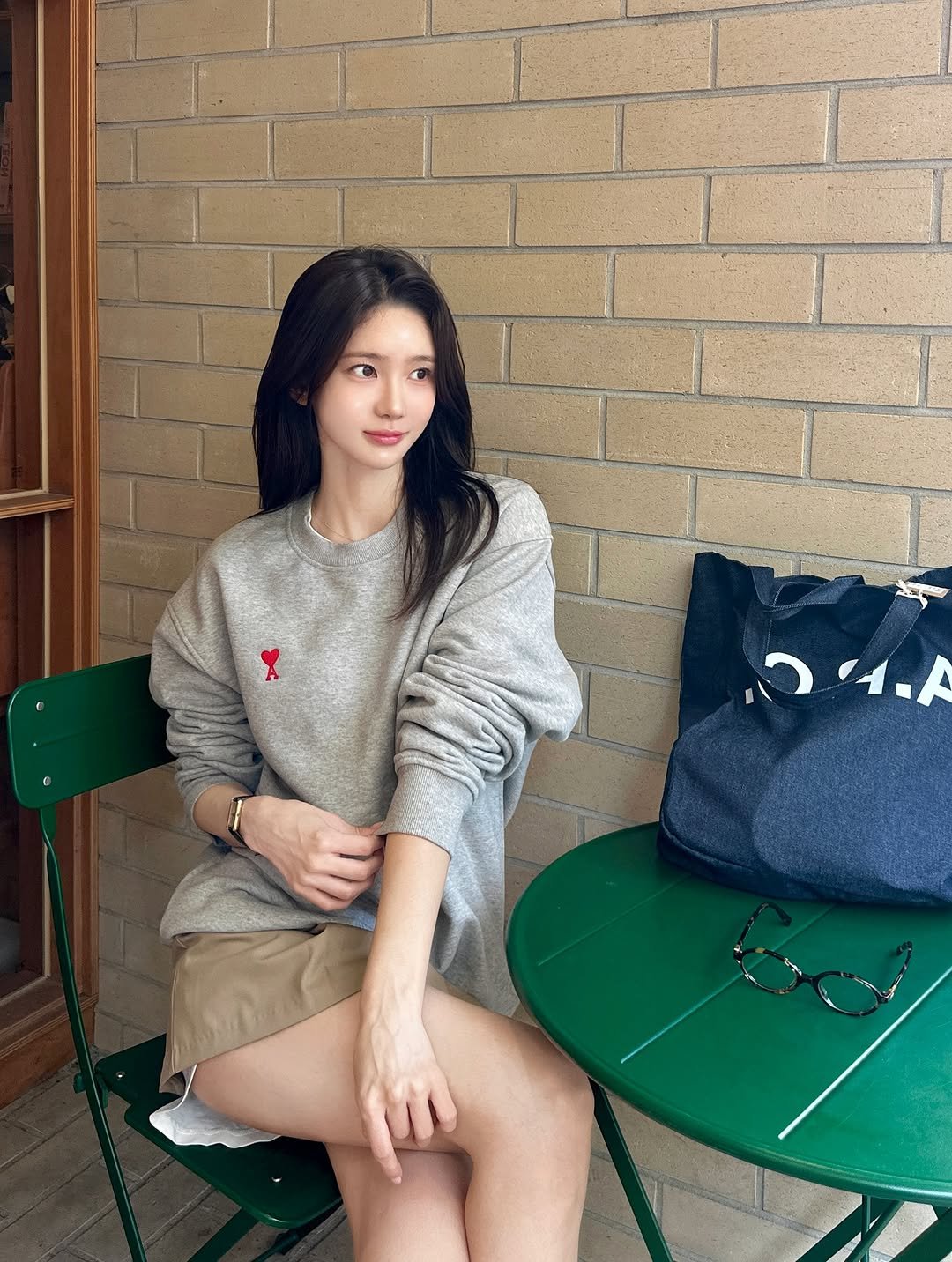 Photo by 김민희 on September 02, 2025. May be an image of 1 person, hair, duffle coat, miniskirt, shorts, top, cardigan, turtleneck, parka and text that says 'תוירי,'.