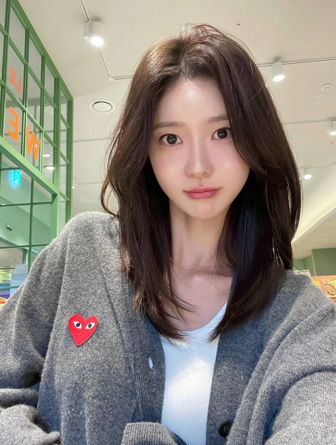 Photo by 김민희 on October 23, 2025. May be an image of one or more people, hair, top and text.