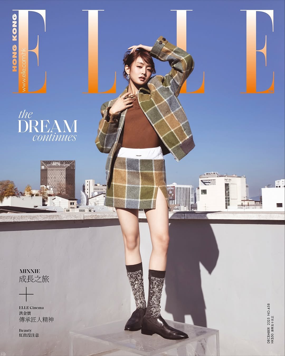 Photo shared by MINNIE on November 22, 2025 tagging @tiffanyandco, @miumiu, and @ellehongkong. May be an image of magazine, turtleneck, shorts, kilt, miniskirt and text.