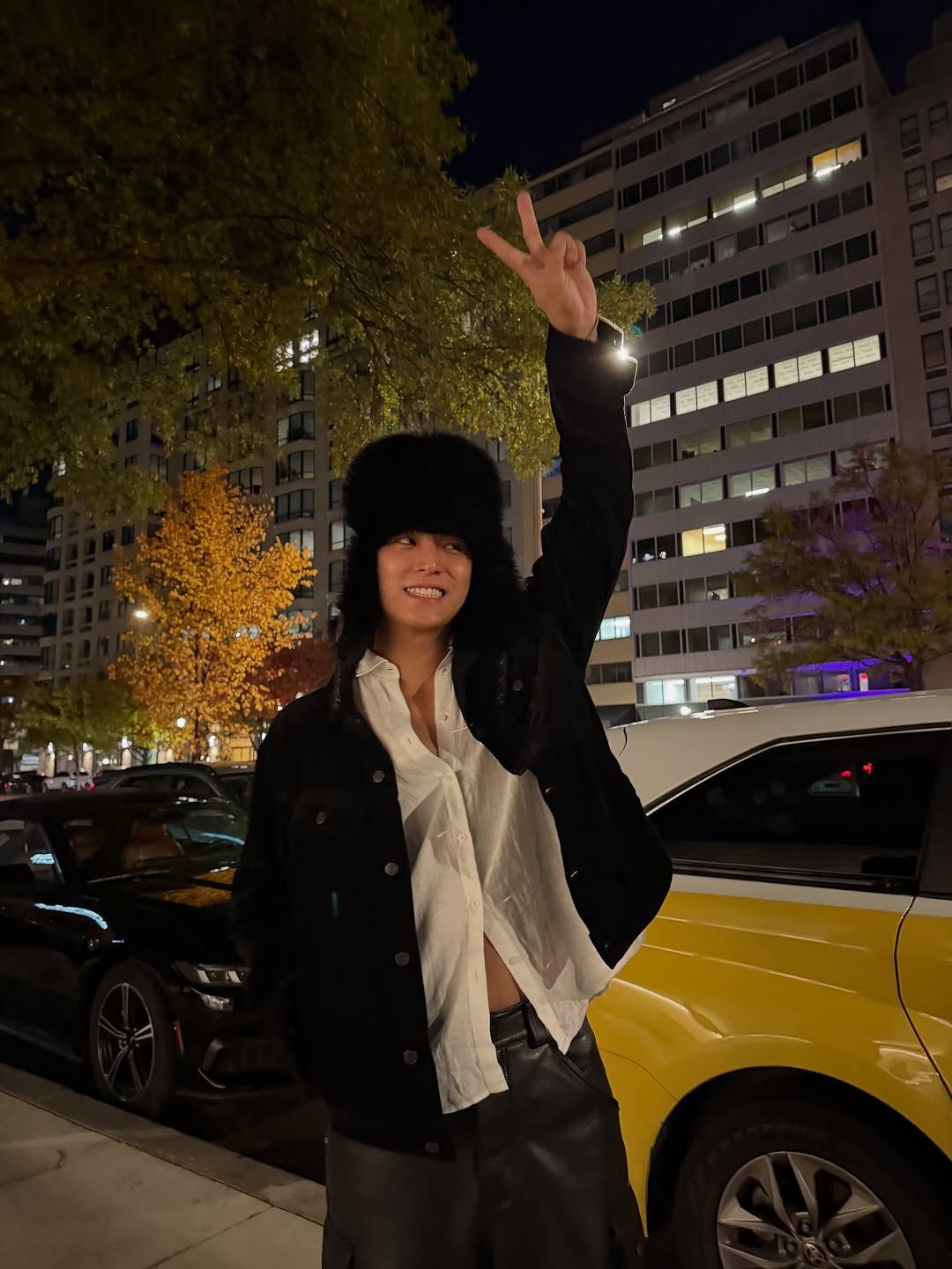 Photo by 김민규 on November 03, 2025. May be an image of standing, overcoat, beret and text.