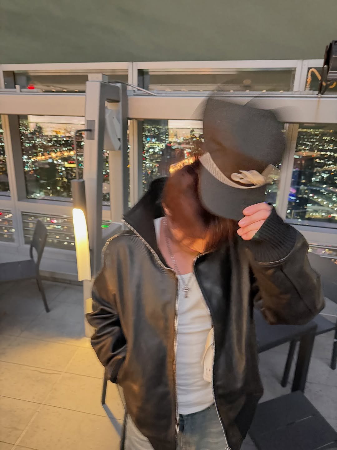 Photo by 김민규 on October 21, 2025. May be an image of hat, flight jacket and text.