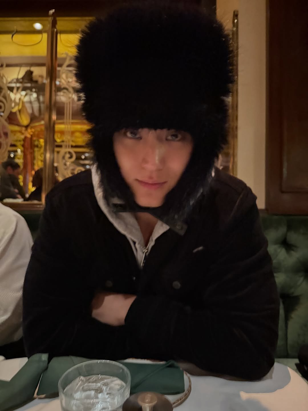 Photo by 김민규 on November 06, 2025. May be an image of duffle coat, hat, fur coat, parka, beret and text.