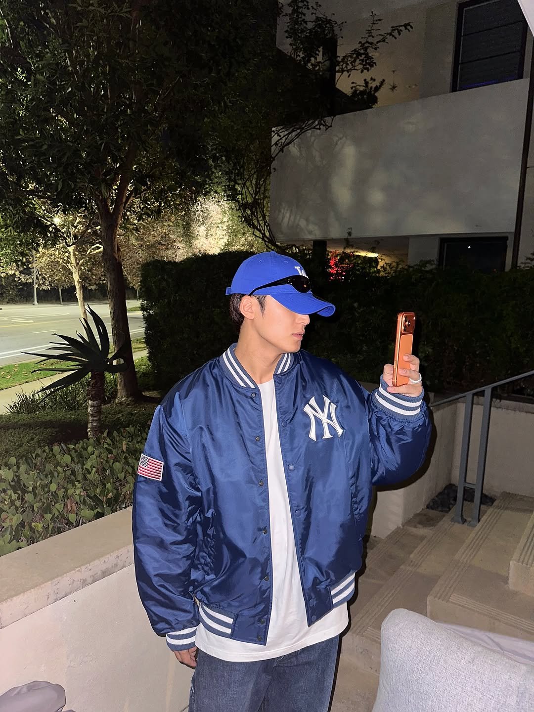 Photo by 김민규 on October 25, 2025. May be an image of hat, flight jacket and text.