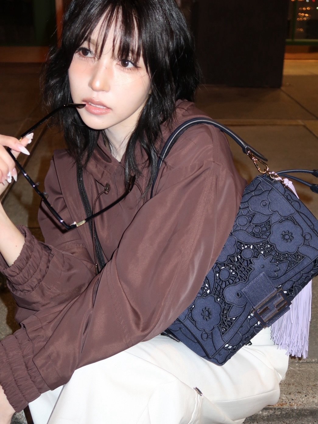 Photo by 미나 (MINA) on April 14, 2026. May be an image of clutch, purse and text.