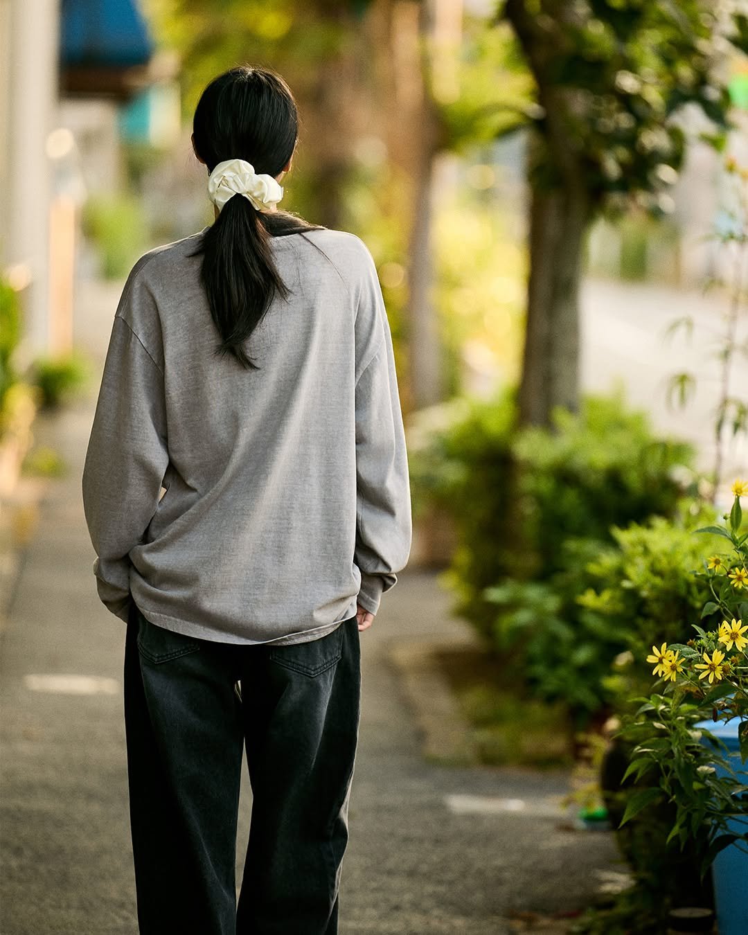 Photo by MINIMALPROJECT on August 18, 2025. May be an image of one or more people, braids and street.