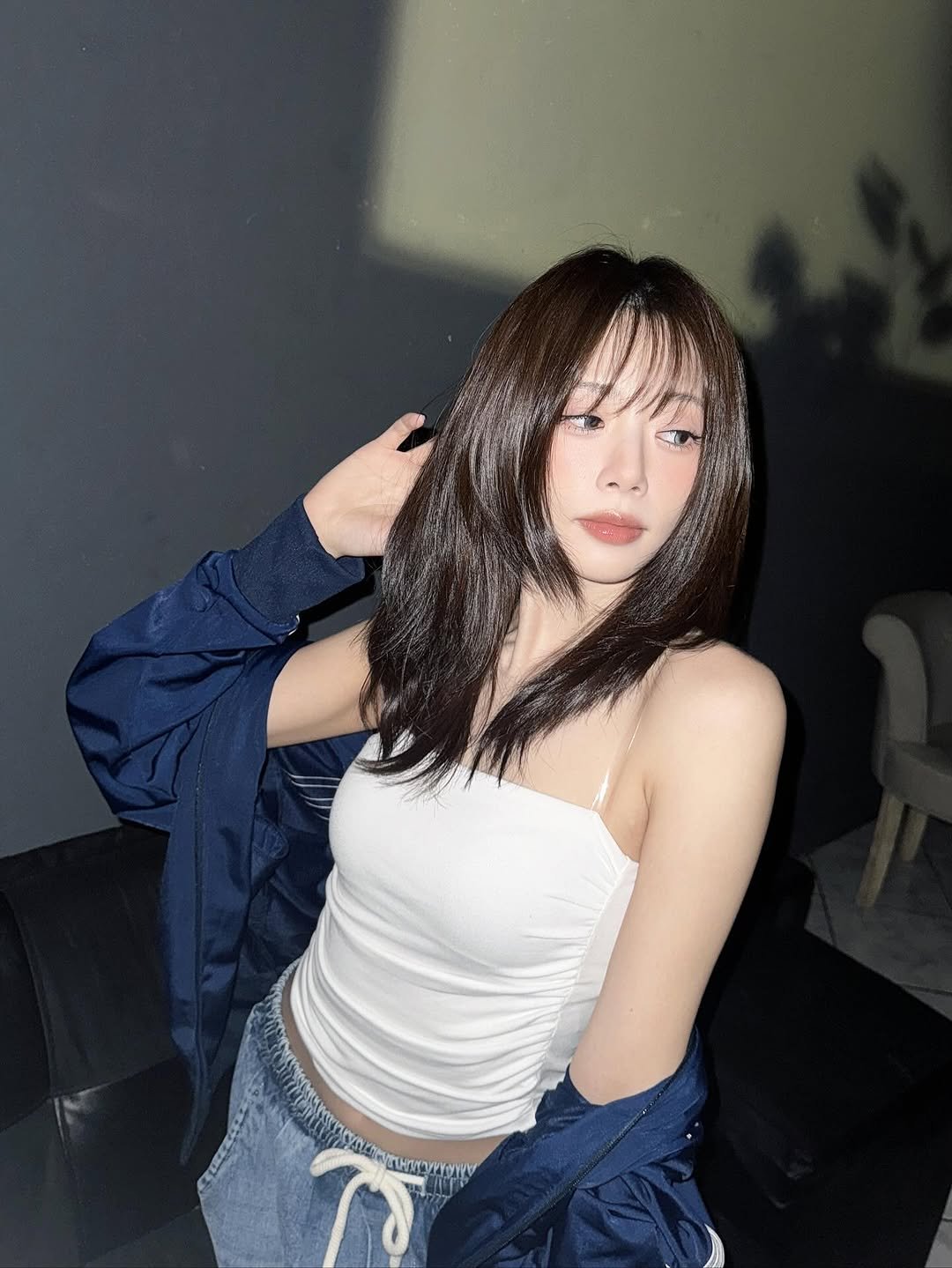 Photo by 드림캐쳐 지유 on August 17, 2025. May be an image of 1 person, hair, sleepwear, parka, top and text.