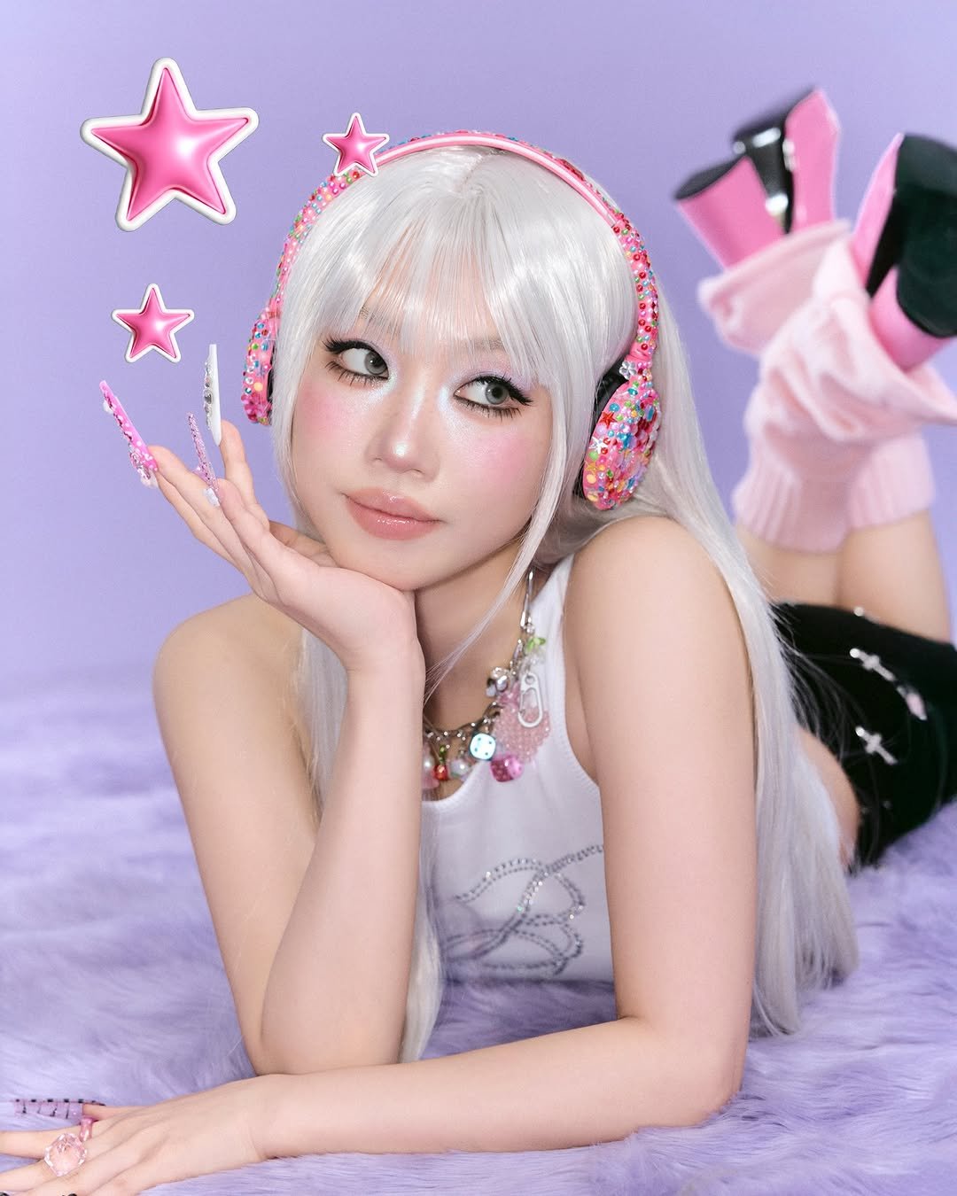 Photo by 민스코 Minsco on January 31, 2026. May be an image of one or more people, makeup, hair, costume and text.