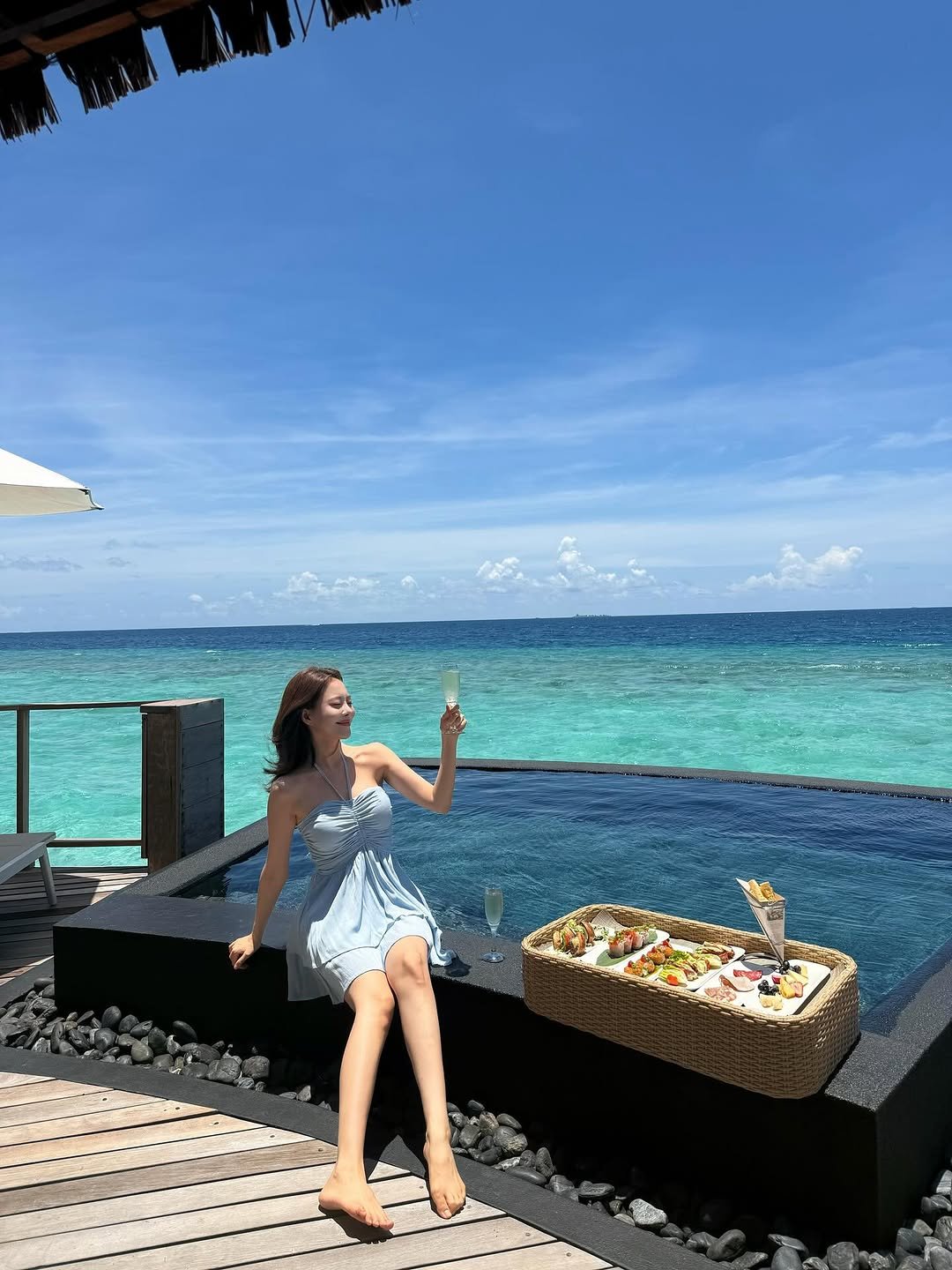 Photo shared by 김민영🌸아옳이 on September 26, 2025 tagging @constancehotels. May be an image of 1 person, sarong, ocean, cabana and text.