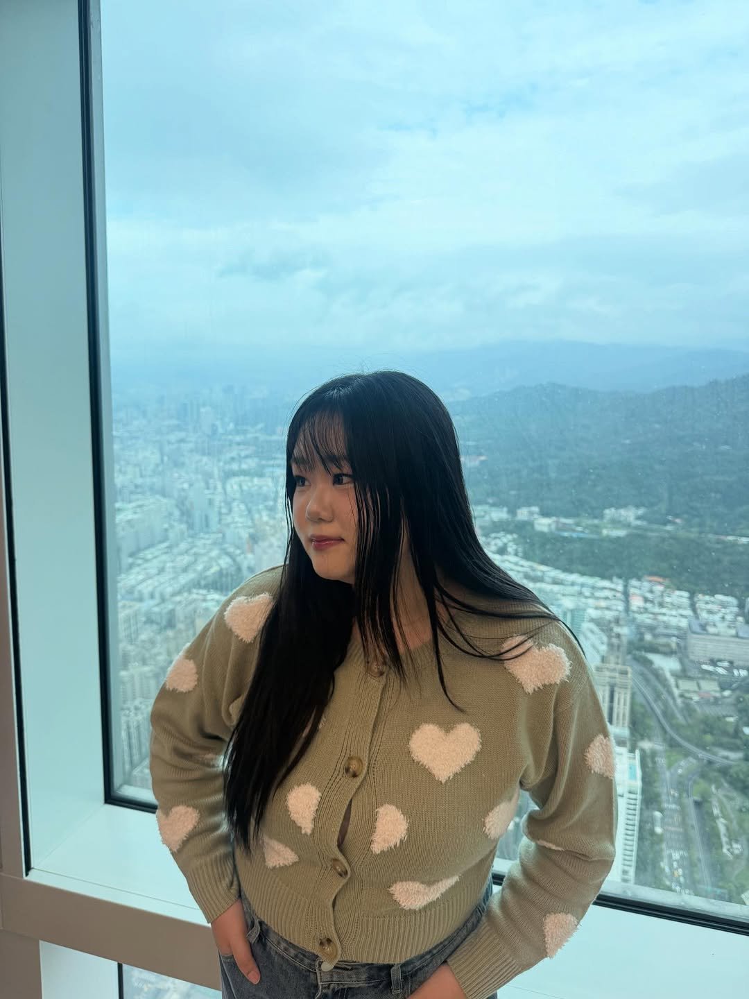 Photo by 미소 miso on April 11, 2026. May be an image of turtleneck, top, skyscraper, Victoria Peak, tower and text.