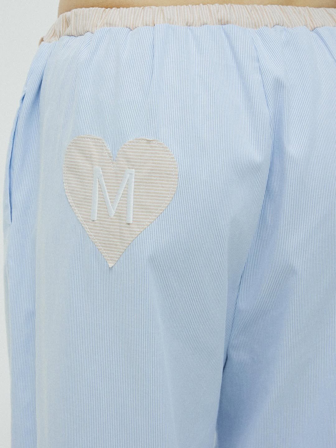 Photo by Mistic Moon (미스틱문) on September 11, 2025. May be an image of sleepwear, shorts and text.