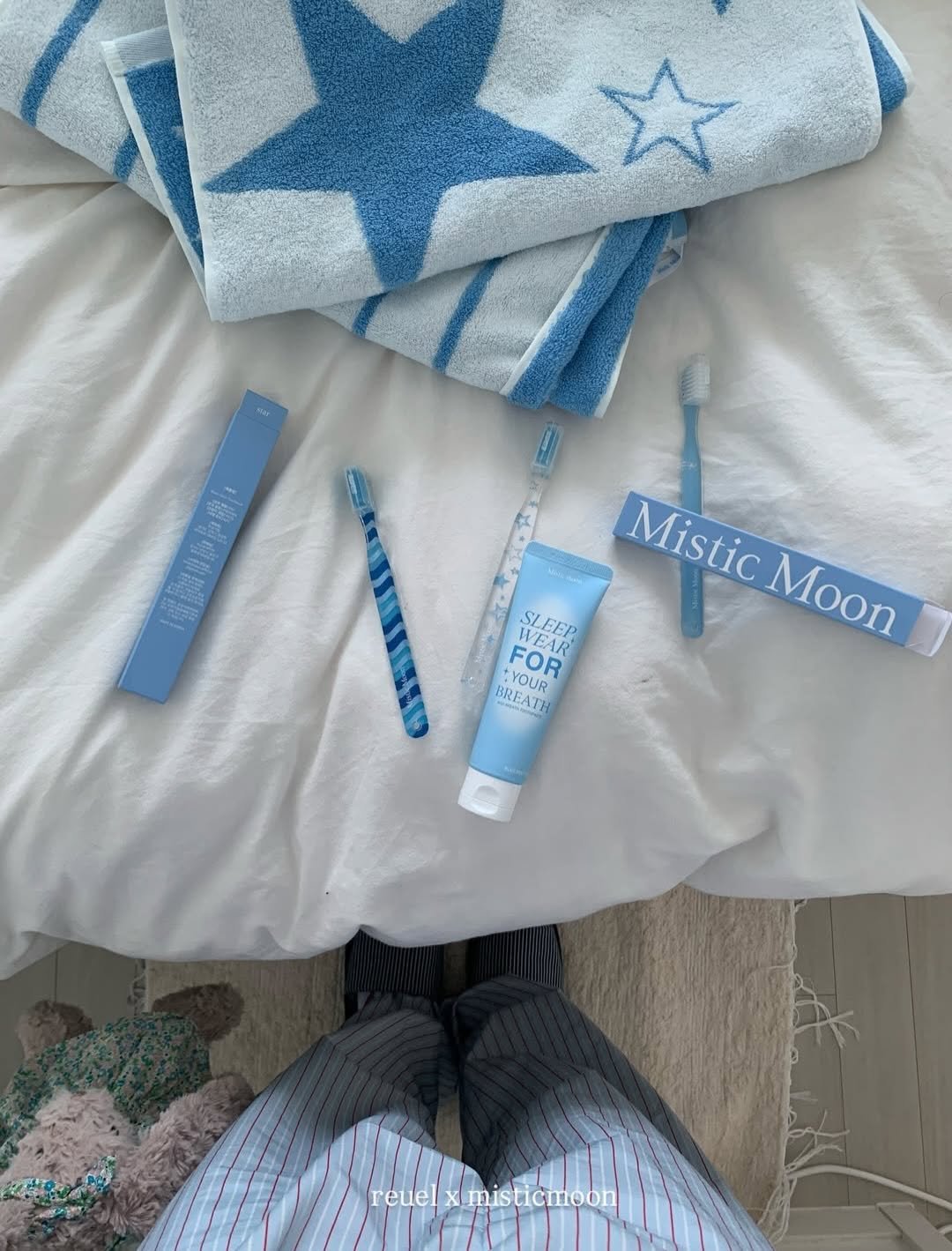 Photo shared by Mistic Moon (미스틱문) on February 03, 2026 tagging @reuel.haus. May be an image of towel, sleepwear, blanket, bath robe, toothbrush, hand cream and text that says 'E Mistic Mistic WEAR WEAR SUCER SLEEP Moon Moon FOR BREATH TH YOUR BREA reuel misticmoon'.