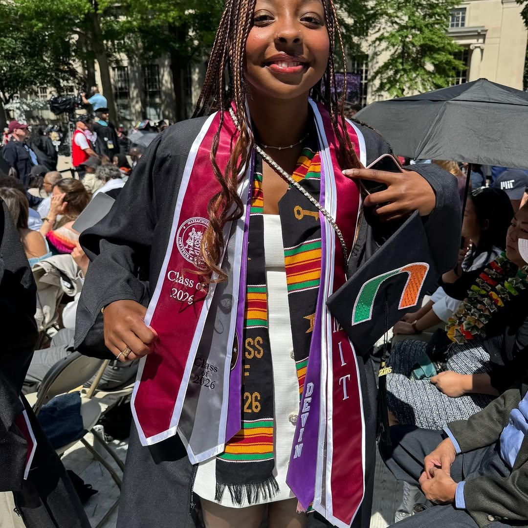 A graduate wearing several stoles.