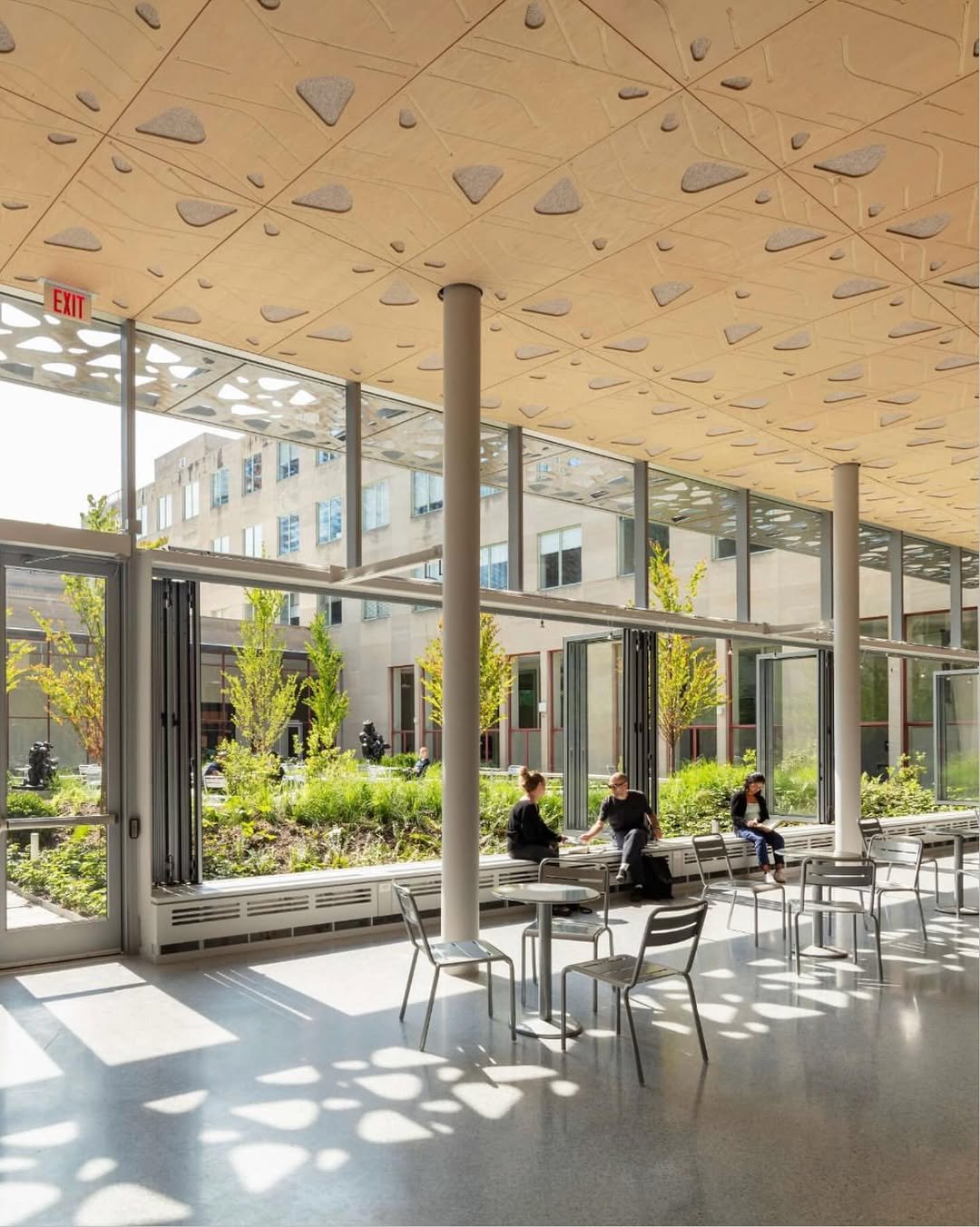 Photo by MIT on September 29, 2025. May be an image of 5 people, hallway, buildings, office and text.
