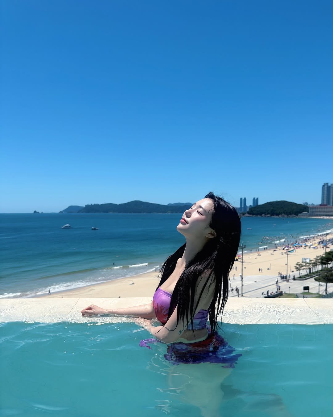 Photo by 미우 MIU on August 02, 2025. May be an image of 1 person, pool, beach, ocean and text.