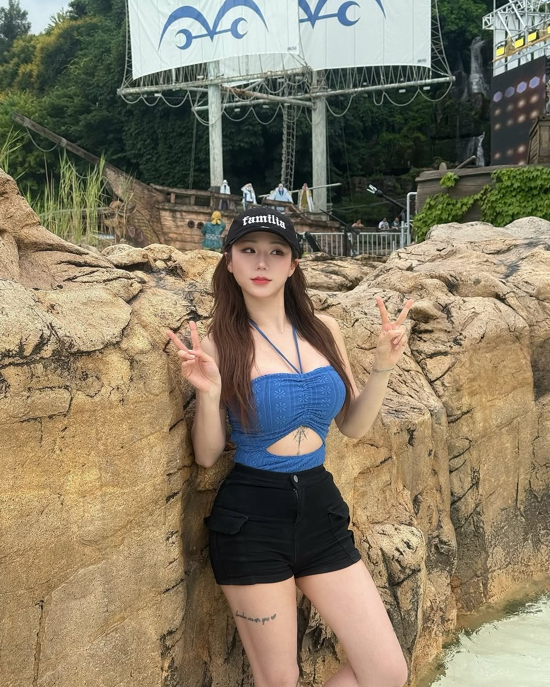 Photo by 미우 MIU on July 16, 2025. May be an image of 1 person, costume, shorts and text that says 'X-C famtlia'.
