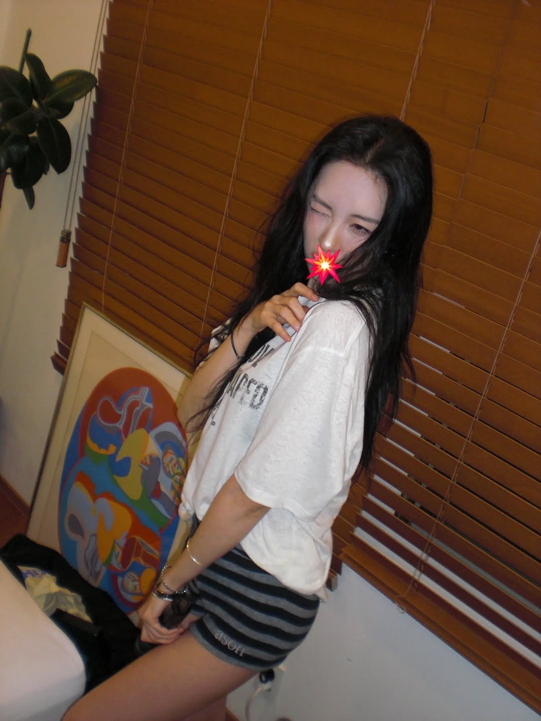 Photo by SUNMI on January 31, 2026. May be an image of sleepwear, underwear, cigarette, shorts, lollipop, miniskirt and text.