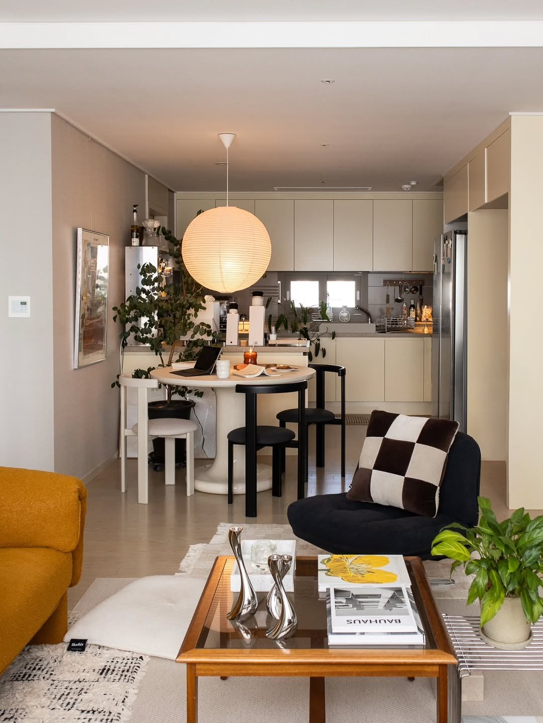 Photo shared by Megan | 메건's home on September 25, 2025 tagging @ikea. May be an image of lighting, sofa, living room, indoors and text.