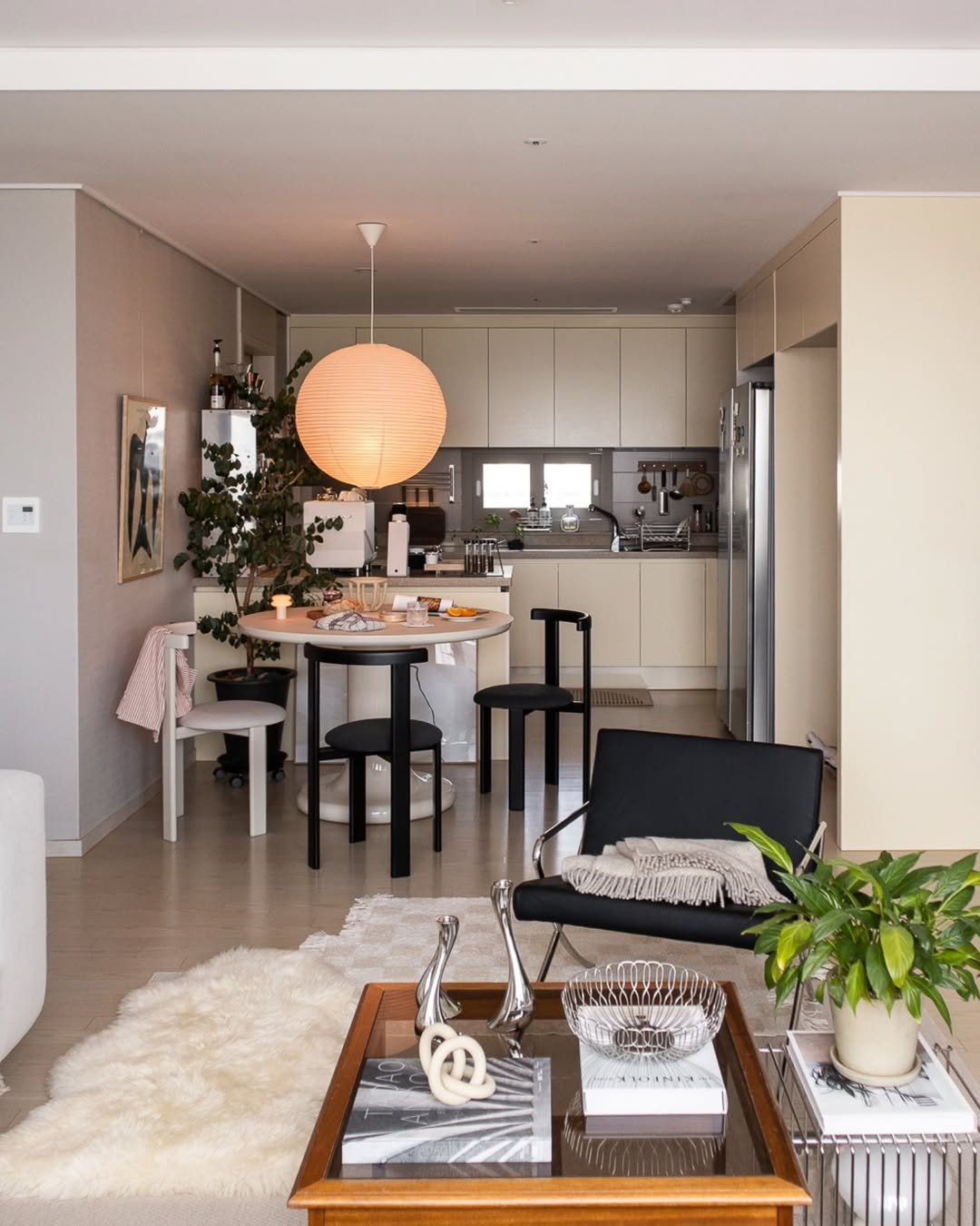 Photo shared by Megan | 메건's home on August 09, 2025 tagging @georgjensen, and @nordicnest.kr. May be an image of lighting, sofa, dining table, living room, indoors and text.