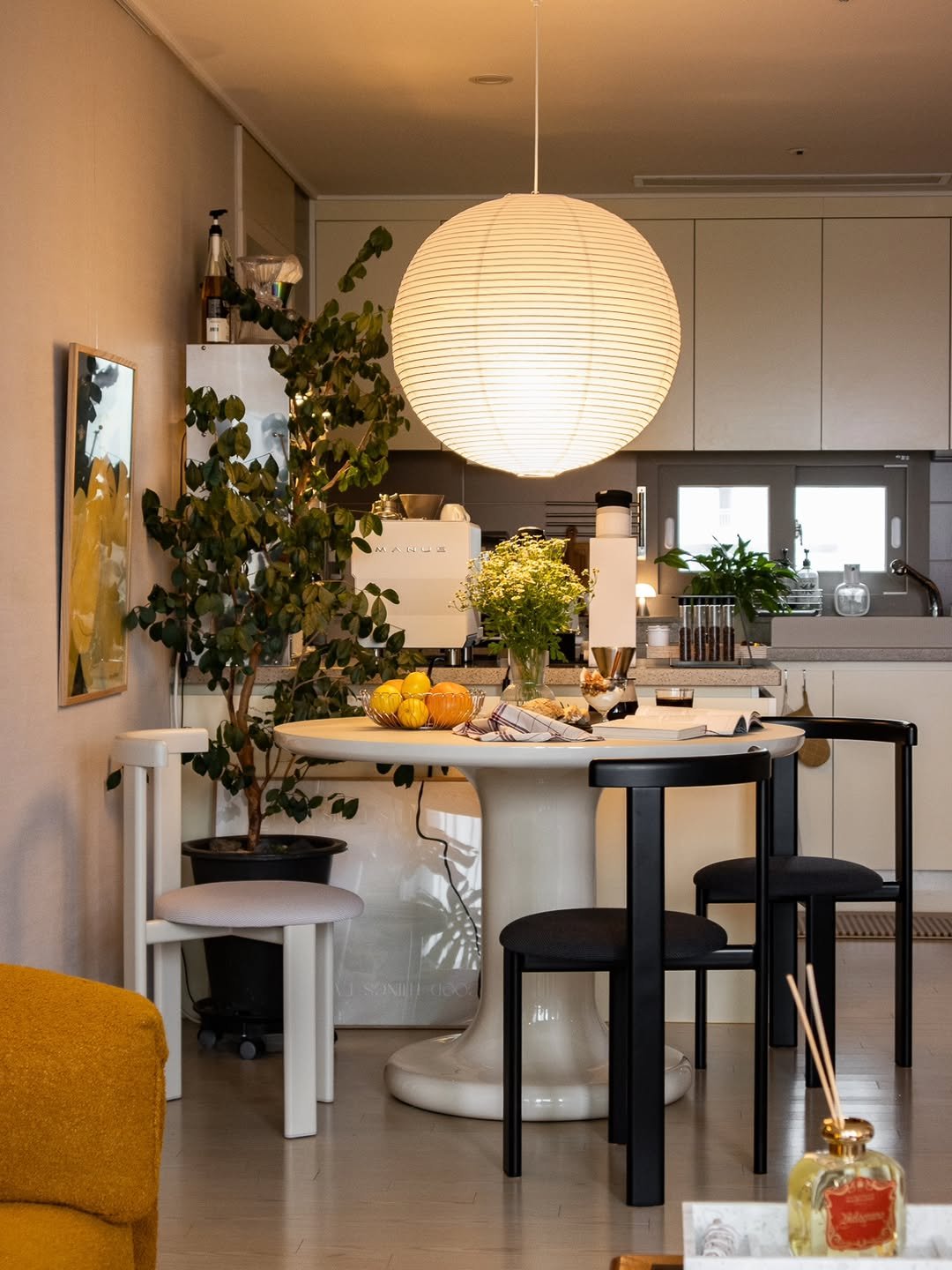 Photo shared by Megan | 메건's home on November 03, 2025 tagging @haydesign, and @flat_point. May be an image of sink, table, lighting, dining table, kitchen table, indoors and text.