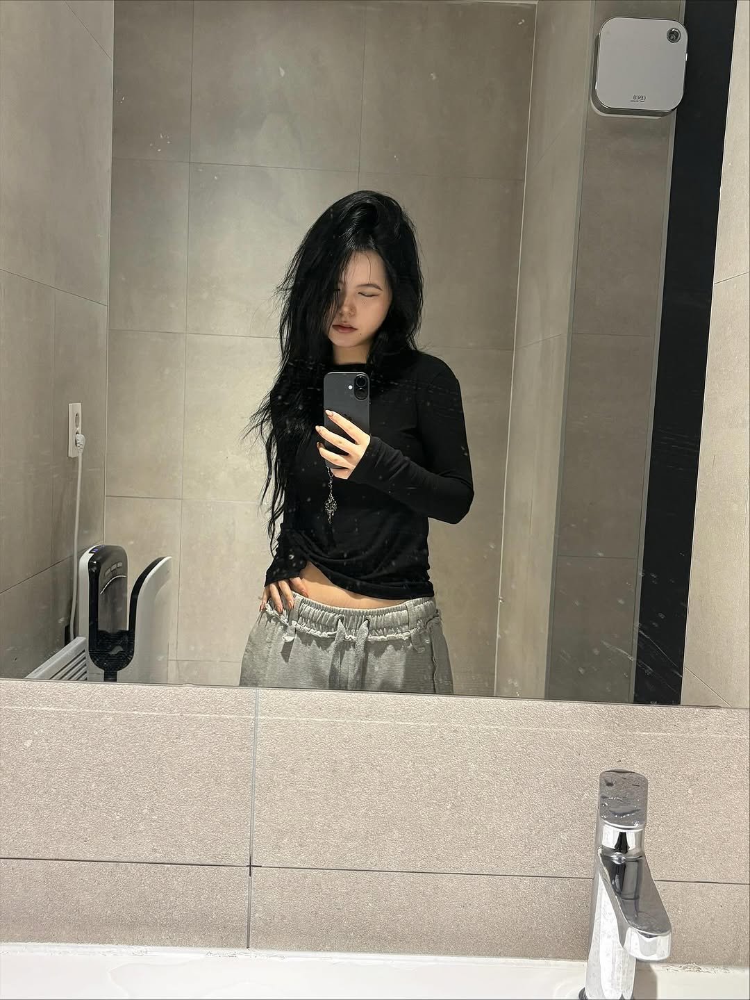 Photo by Hyebin Kim on November 25, 2025. May be a selfie of one or more people, long hair, sweatpants, sweatsuit, sweatshirt, mirror and text.