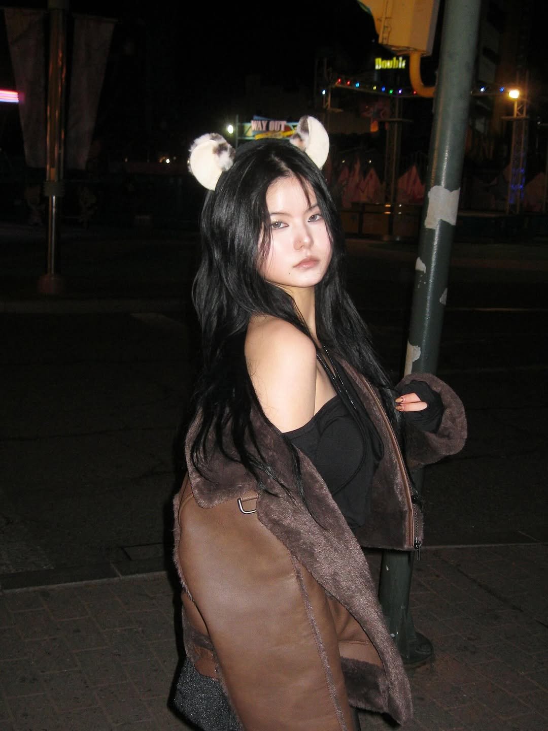 Photo shared by Hyebin Kim on November 26, 2025 tagging @afterhours.co.kr. May be an image of leather, fur coat, headdress, fishnet stockings and text.