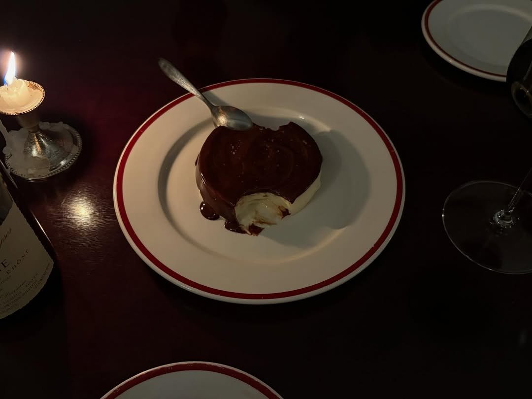 Photo by Hyebin Kim on January 16, 2026. May be an image of souffle, candle, chocolate cake, chocolate mousse and text.