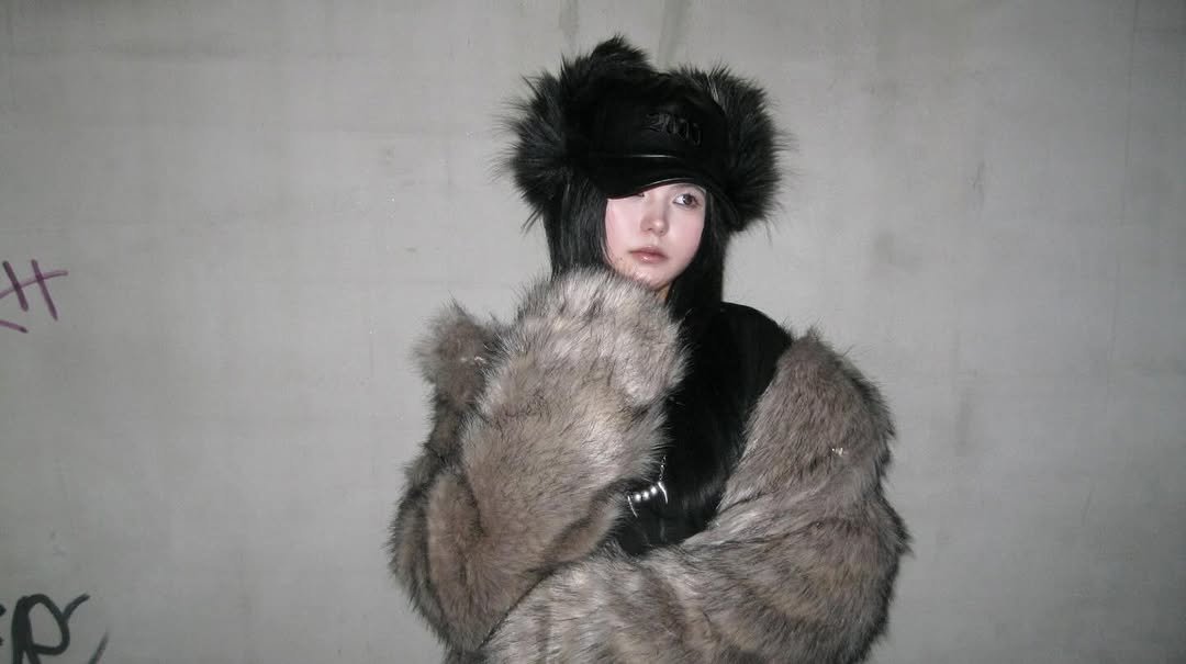 Photo by Hyebin Kim on December 05, 2025. May be an image of bear, hat, sable coat, goosedown coat, duffle coat, parka, beret and text.