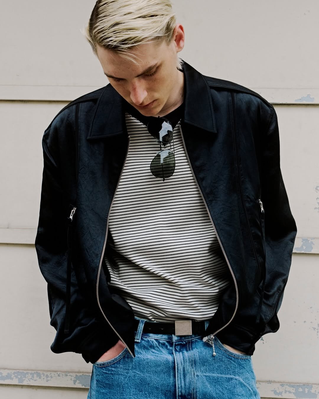 Photo by MMIC (엠엠아이씨) on April 16, 2026. May be an image of bolo tie, belt, flight jacket and text.