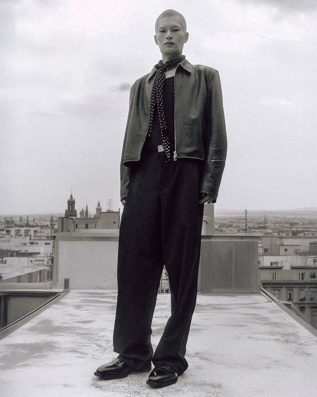 Photo by MMIC (엠엠아이씨) on February 11, 2026. May be an image of suit, overcoat, turtleneck and text.