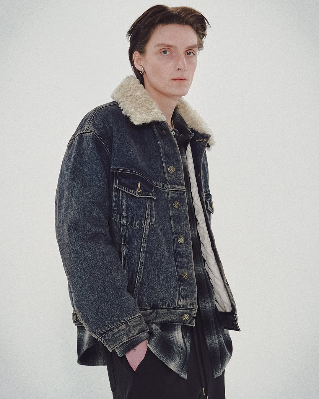 Photo by MMIC (엠엠아이씨) on October 28, 2025. May be an image of duffle coat, overcoat, goosedown coat, jacket and text.