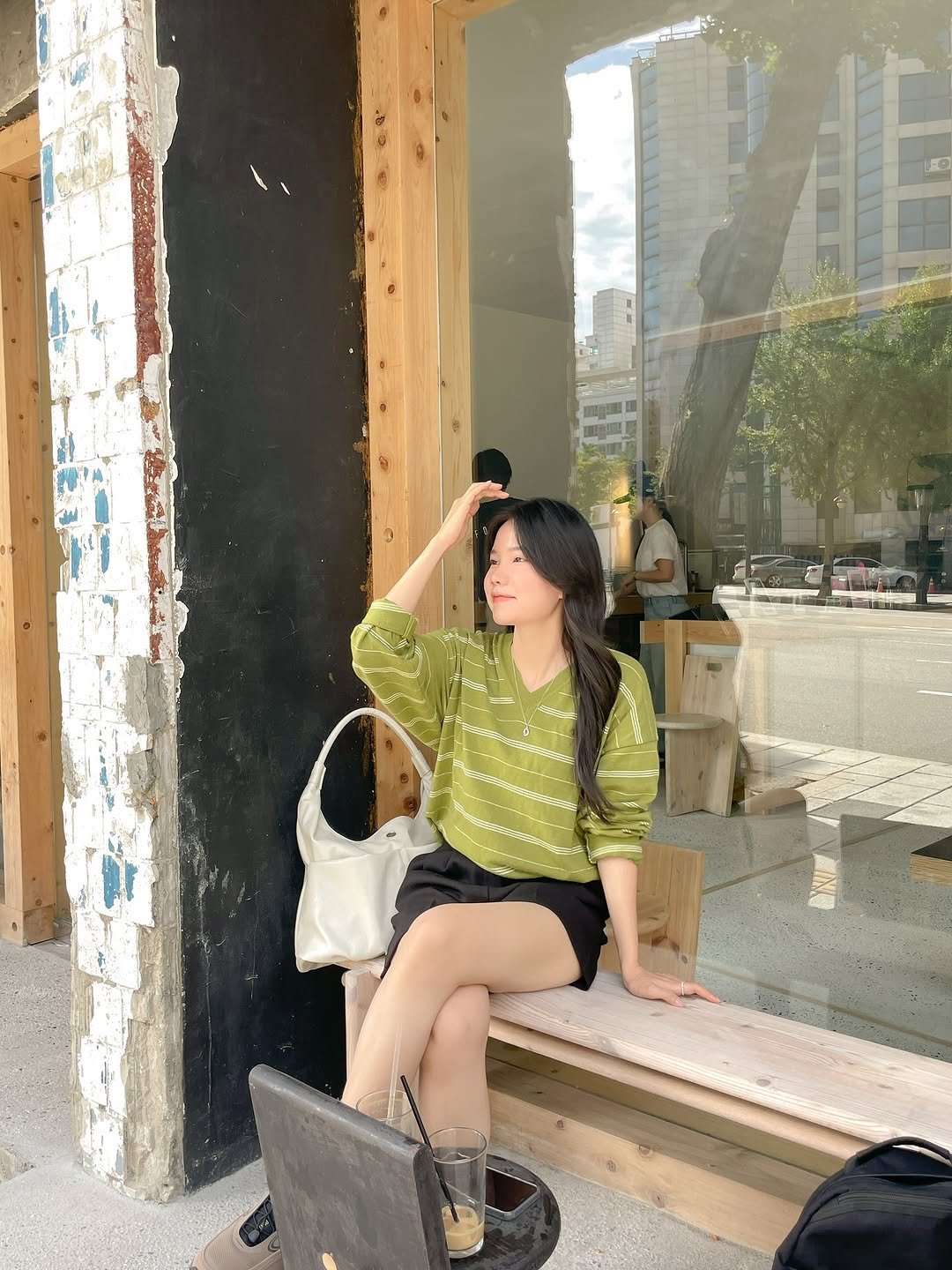 Photo by 모아벨르 | 여니 on September 17, 2025. May be an image of 1 person, shorts, miniskirt, cornflower and text.