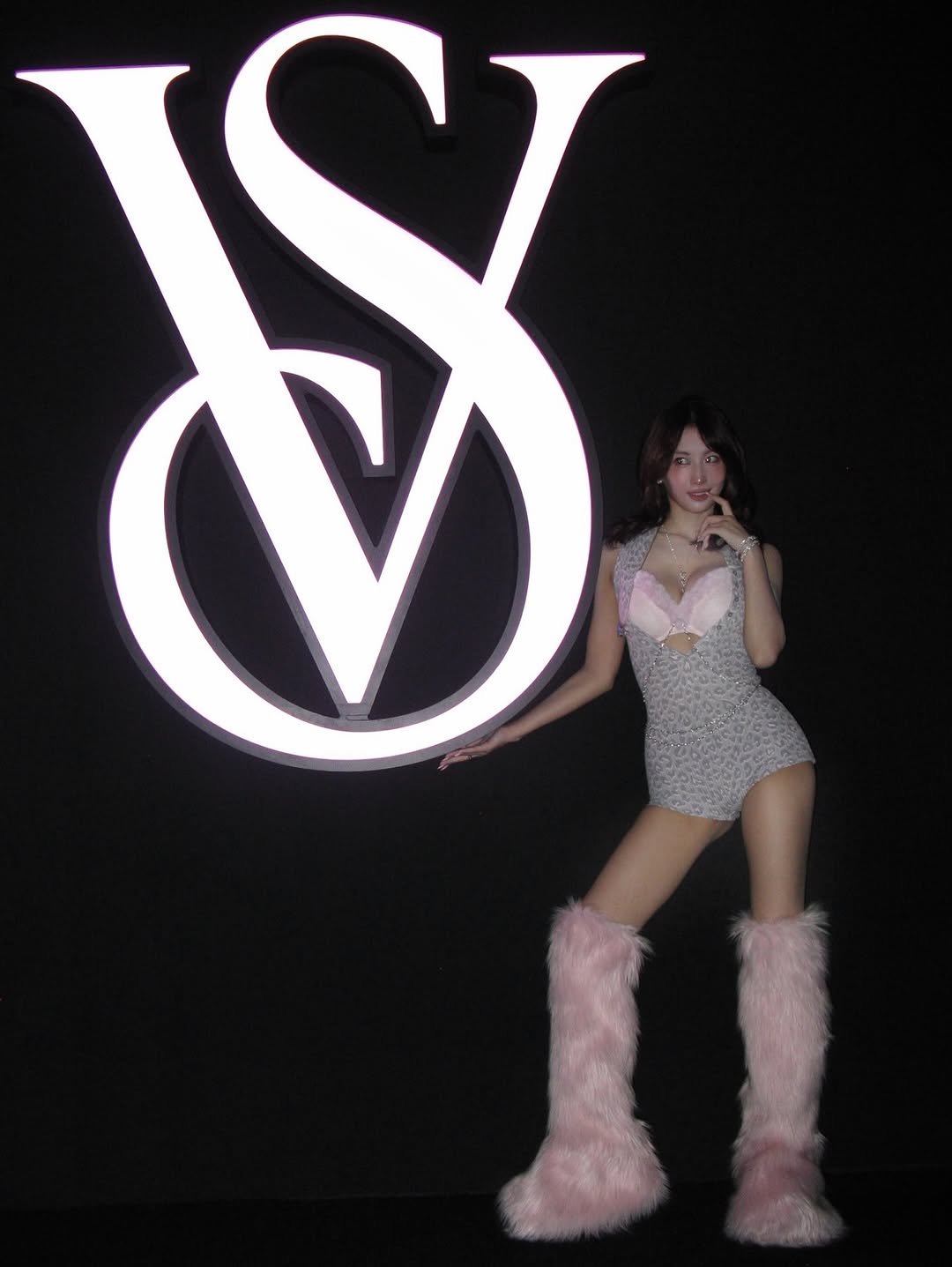 Photo shared by 모모 (MOMO) on October 15, 2025 tagging @victoriassecret. May be an image of one or more people, makeup, costume, fishnet stockings and text.