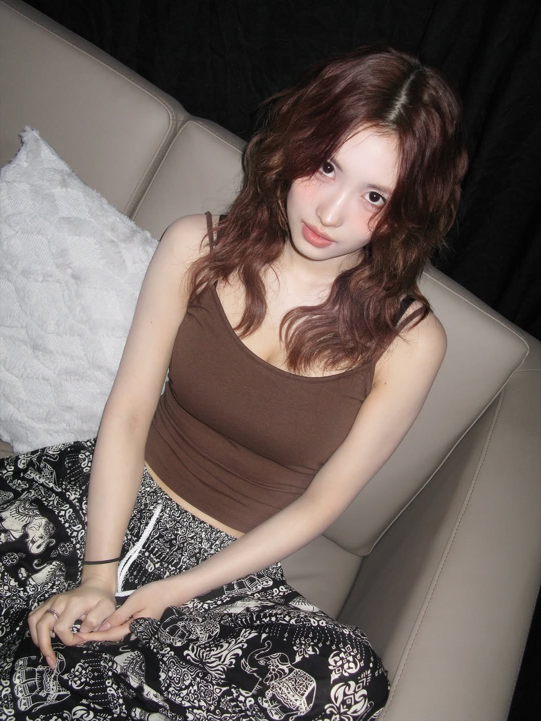 Photo by 모모 (MOMO) on December 16, 2025. May be an image of one or more people, hair, top, miniskirt and text.