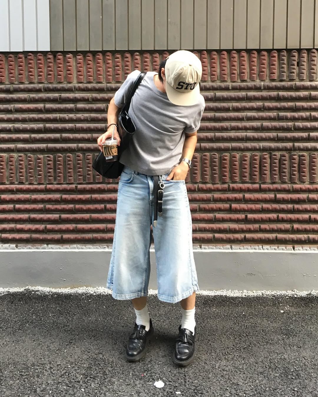 Photo shared by 민 서 on August 18, 2025 tagging @stussy, @newcheapchic, @lmood_official, @uniformdisplay, @mjd_official, @feedxwear, @wmc_official, @what.you.wearing, @secrets.jp, @divein.kr, @ffits4, and @kamien.kr. May be an image of 1 person, street and text.