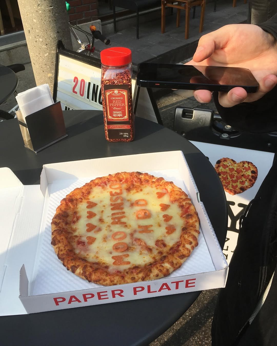 Photo by 민 서 on December 14, 2025. May be an image of pizza, mozzarella, hot sauce and text.