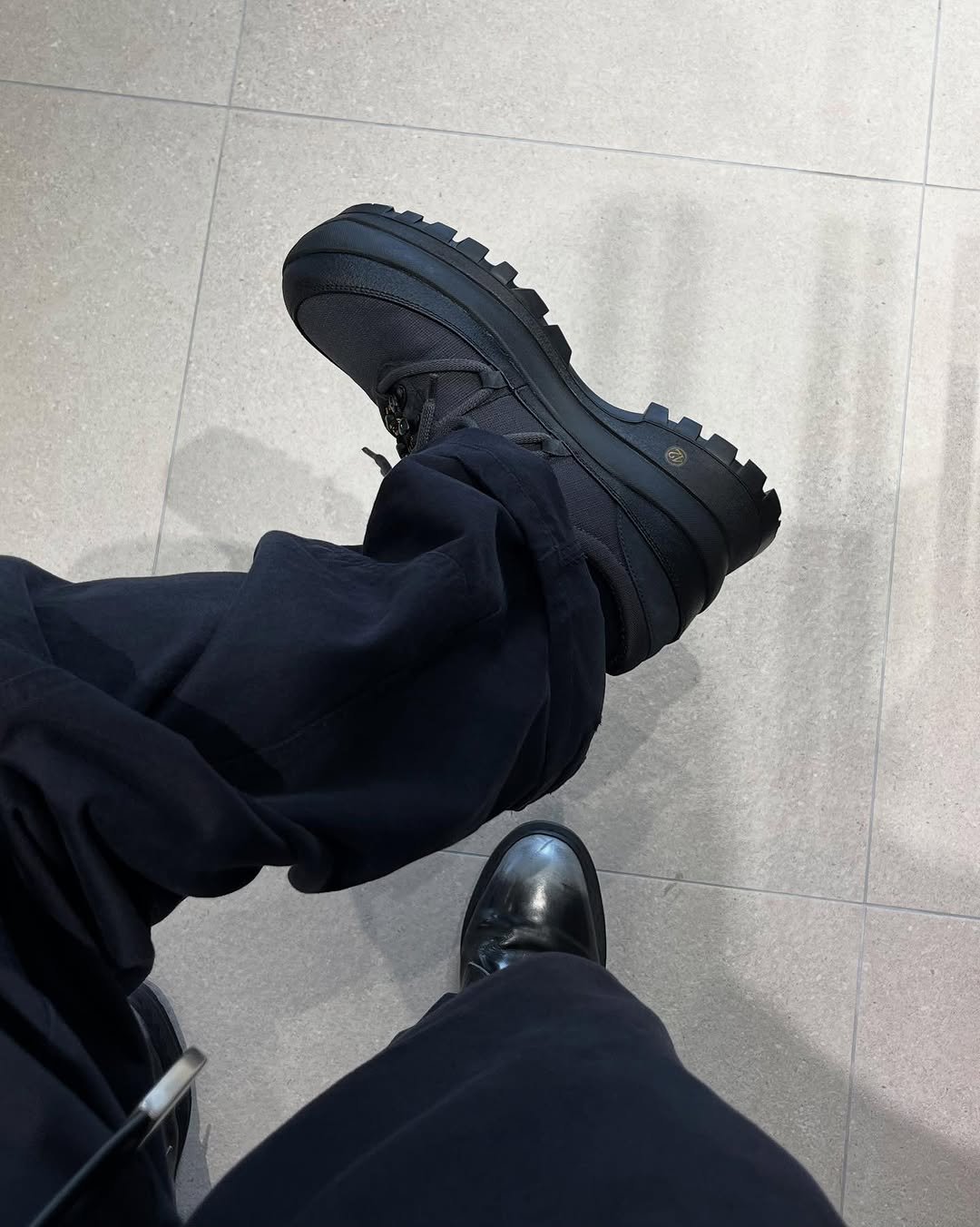 Photo by 민 서 on September 01, 2025. May be an image of wingtip shoes, boots and text.