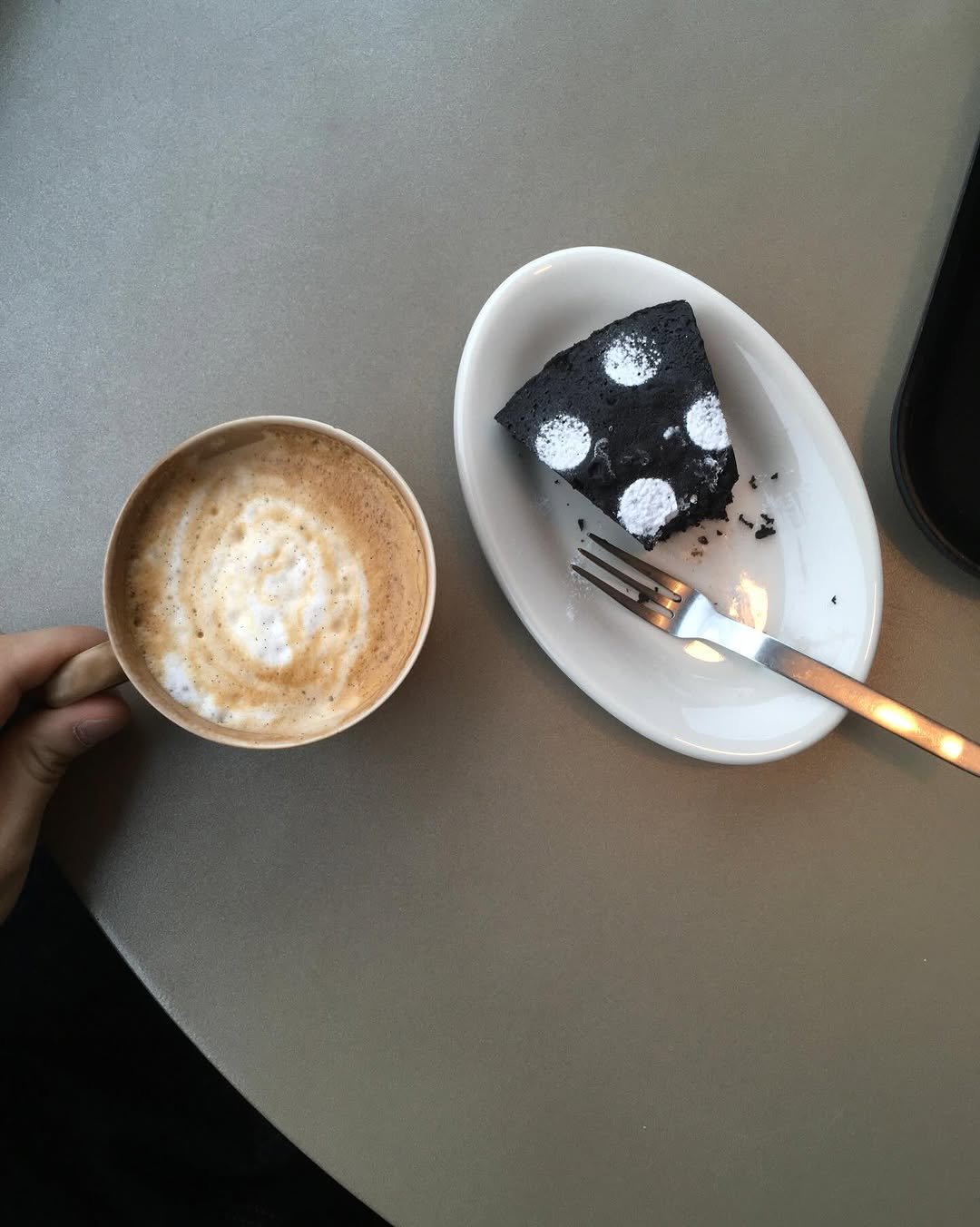 Photo by 민 서 on March 15, 2026. May be an image of coffee, coffee cup, cappuccino, napkin and text.