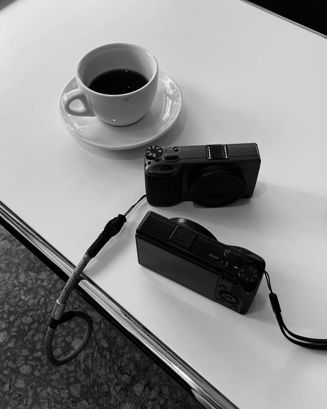 Photo by 민 서 on March 02, 2026. May be a black-and-white image of coffee cup, camera, camcorder, portable cassette player and text.