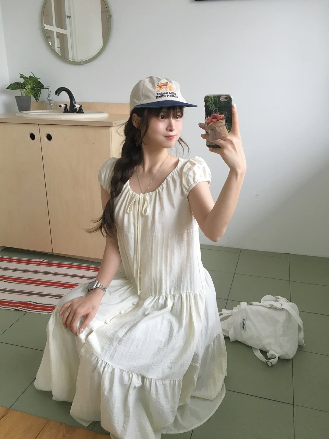 Photo by 무디배디 | 윤달 on August 08, 2025. May be an image of 1 person, hat, dress, sundress and text.
