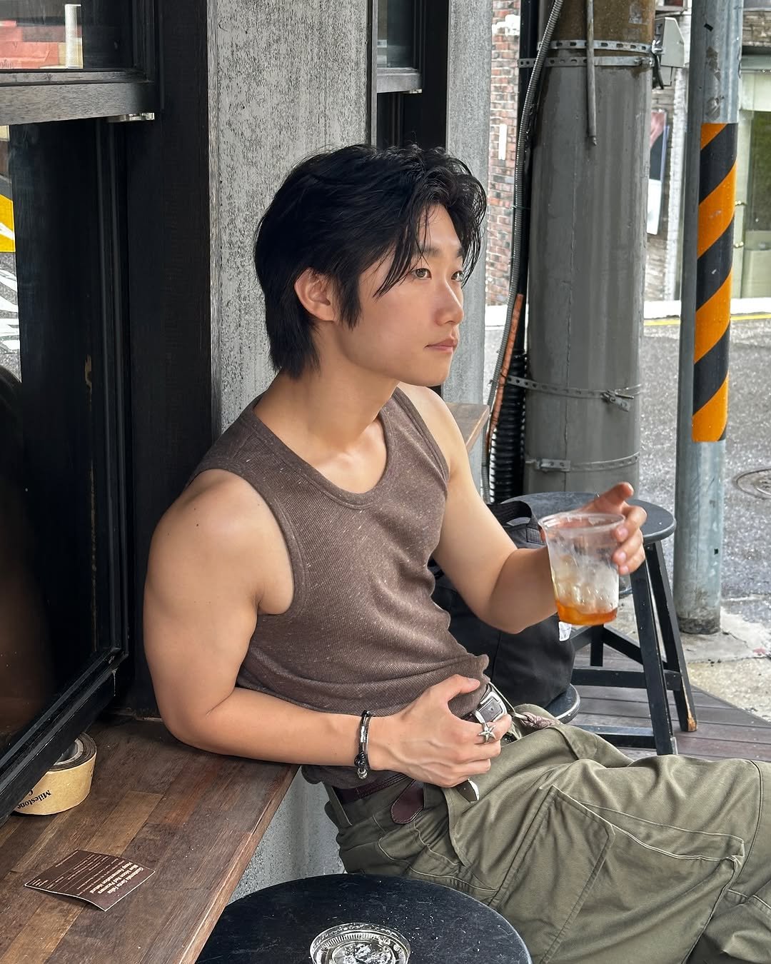 Photo shared by 라오라오 on July 23, 2025 tagging @afterpray_official. May be an image of 1 person, hair, tanktop and text.