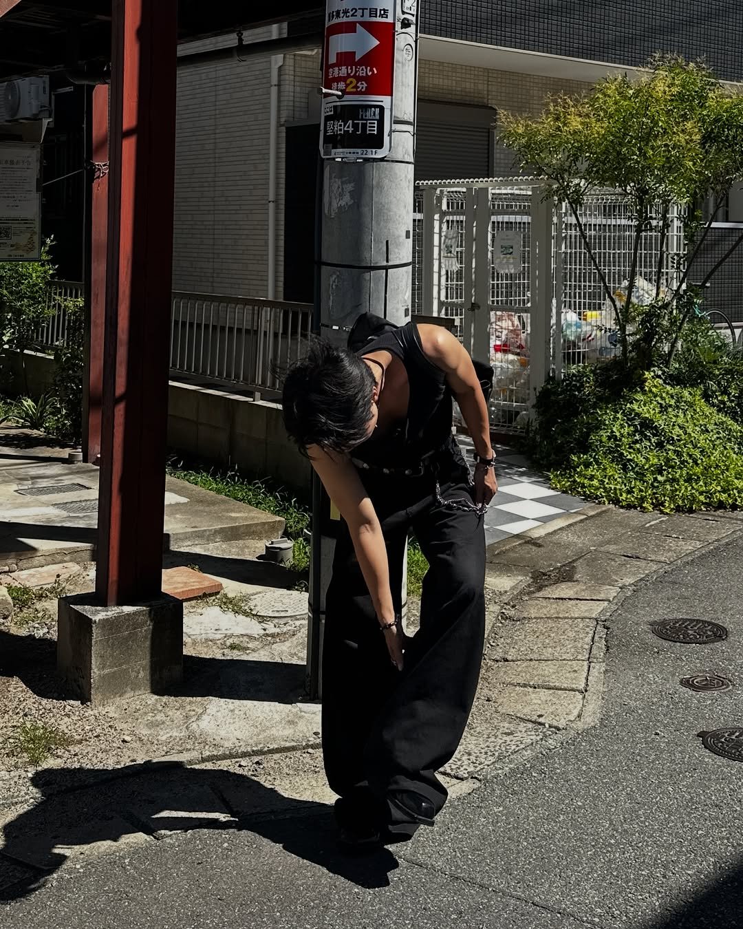 Photo by 라오라오 on July 29, 2025. May be an image of 1 person, parking meter, cigarette, street, curb, telephone pole and text.