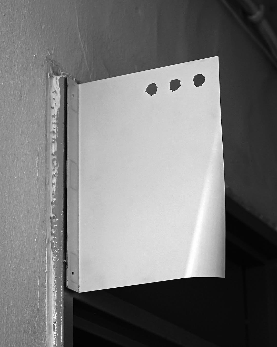 Photo shared by Moonsick Gang on October 15, 2025 tagging @forkkrof. May be a black-and-white image of light switch, door and text.