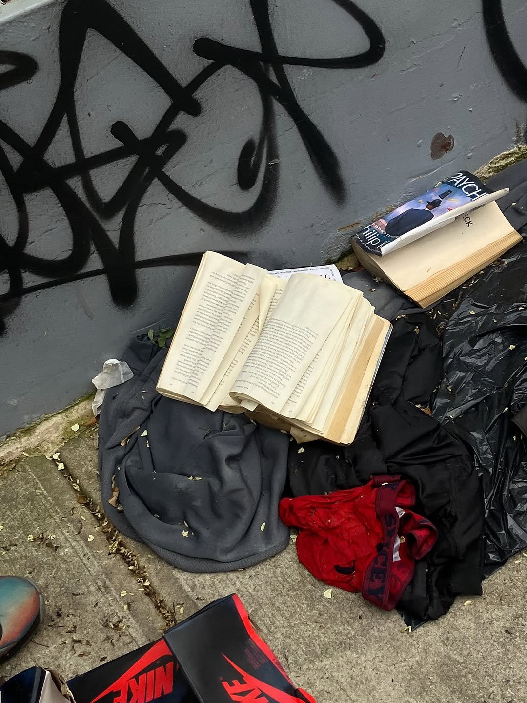 Photo by Moonsick Gang on September 05, 2025. May be an image of book, garbage, newspaper, plastic bag, curb and text.