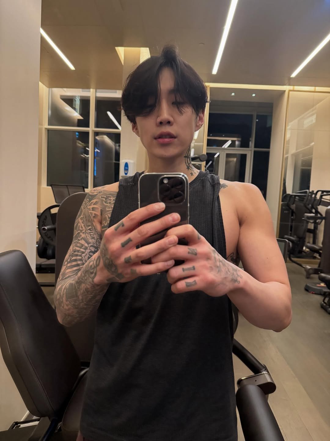 Photo by Jay Park (박재범) 🇰🇷 on February 18, 2026. May be a selfie of one or more people, bangs, biceps, tanktop and text.