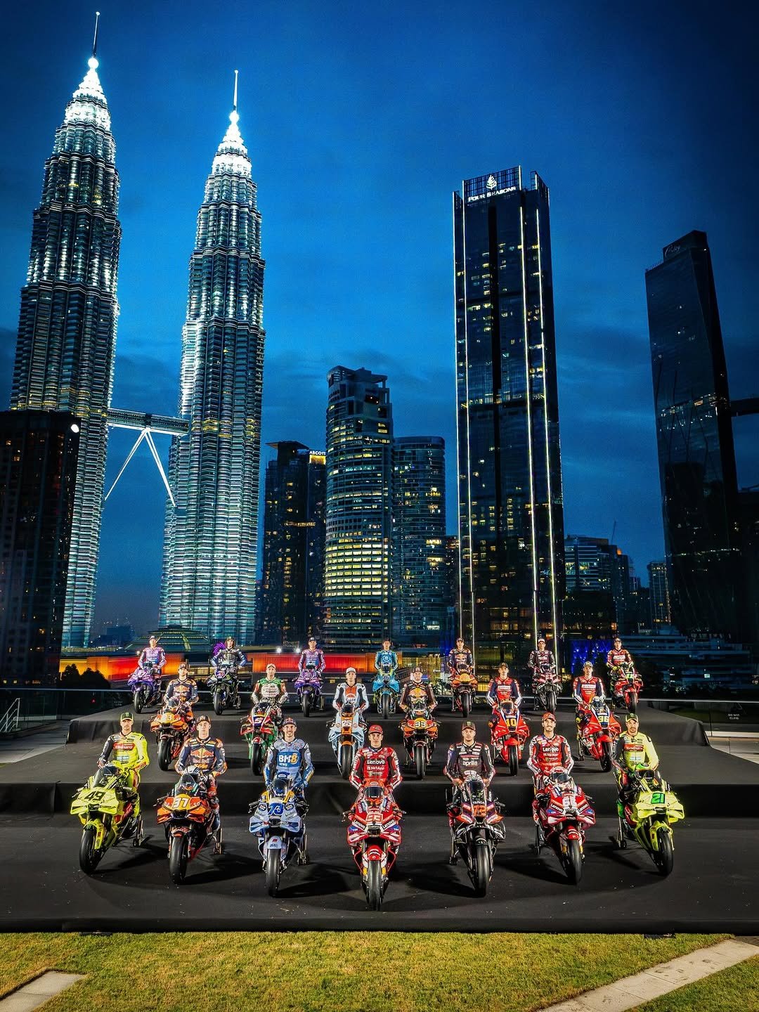 Photo shared by MotoGP™ on February 06, 2026 tagging @jackmilleraus, @bradbinder, @lucamarini10, @alexrins, @fabiodiggia49, @89jorgemartin, @bestia23, @joanmir36official, @toprakrazgatlioglu7, @pecco63, @marcobez72, @raulfernandez_25, @marcmarquez93, @alexmarquez73, @diogomoreira_11, @37pedroacosta, @frankymorbido, @johannzarco, and @aiogura79. May be an image of scooter, skyscraper, tower and text.