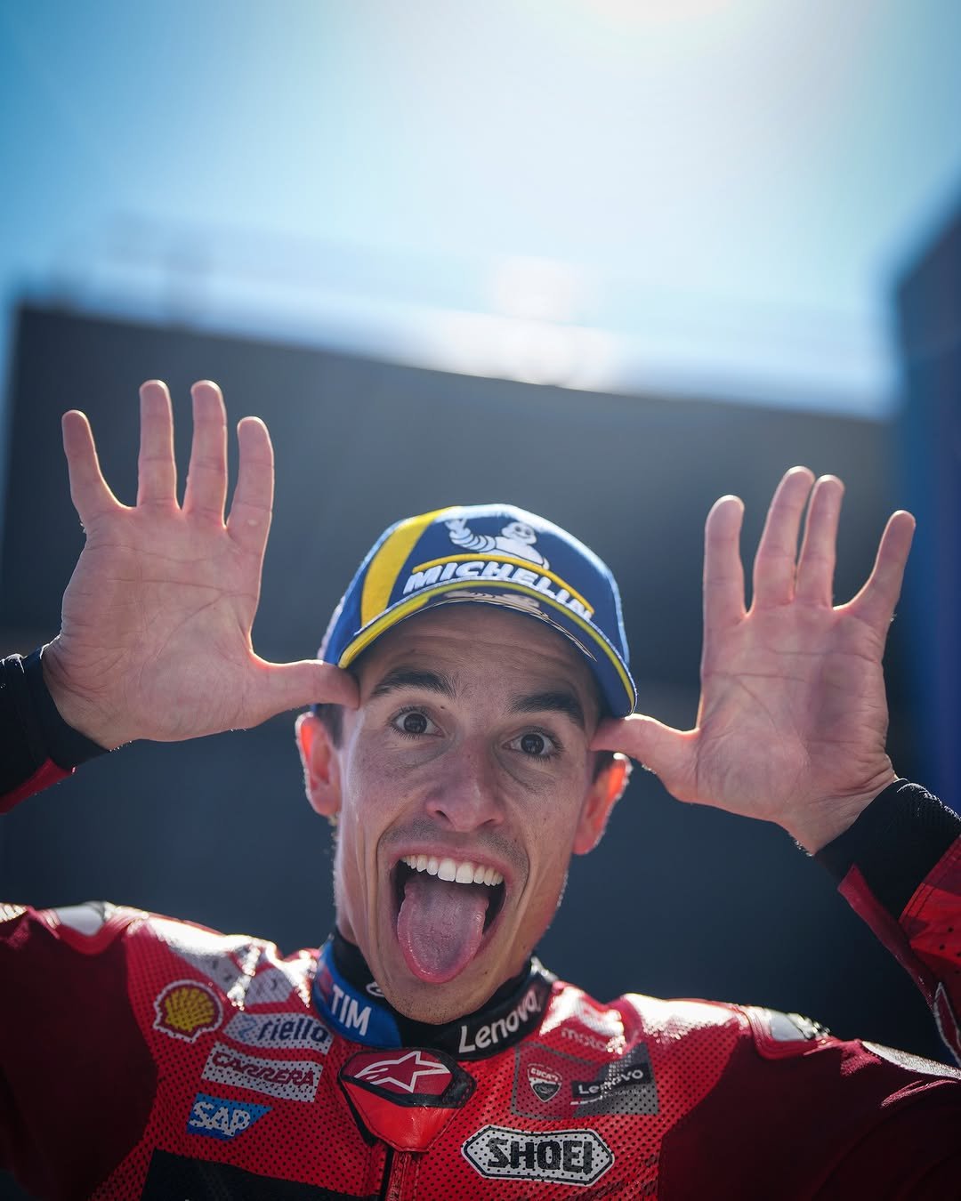 Photo shared by MotoGP™ on December 26, 2025 tagging @marcmarquez93, and @ducaticorse. May be an image of racing vehicles, race car, helmet and text.