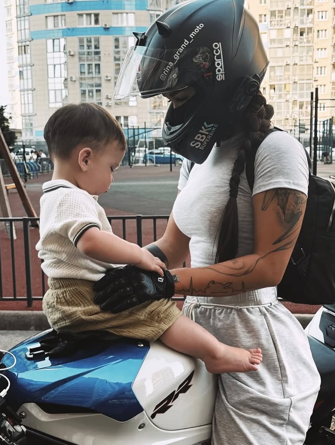 Photo by ❥ on August 14, 2025. May be an image of 2 people, baby, motorcycle, helmet, scooter and text.