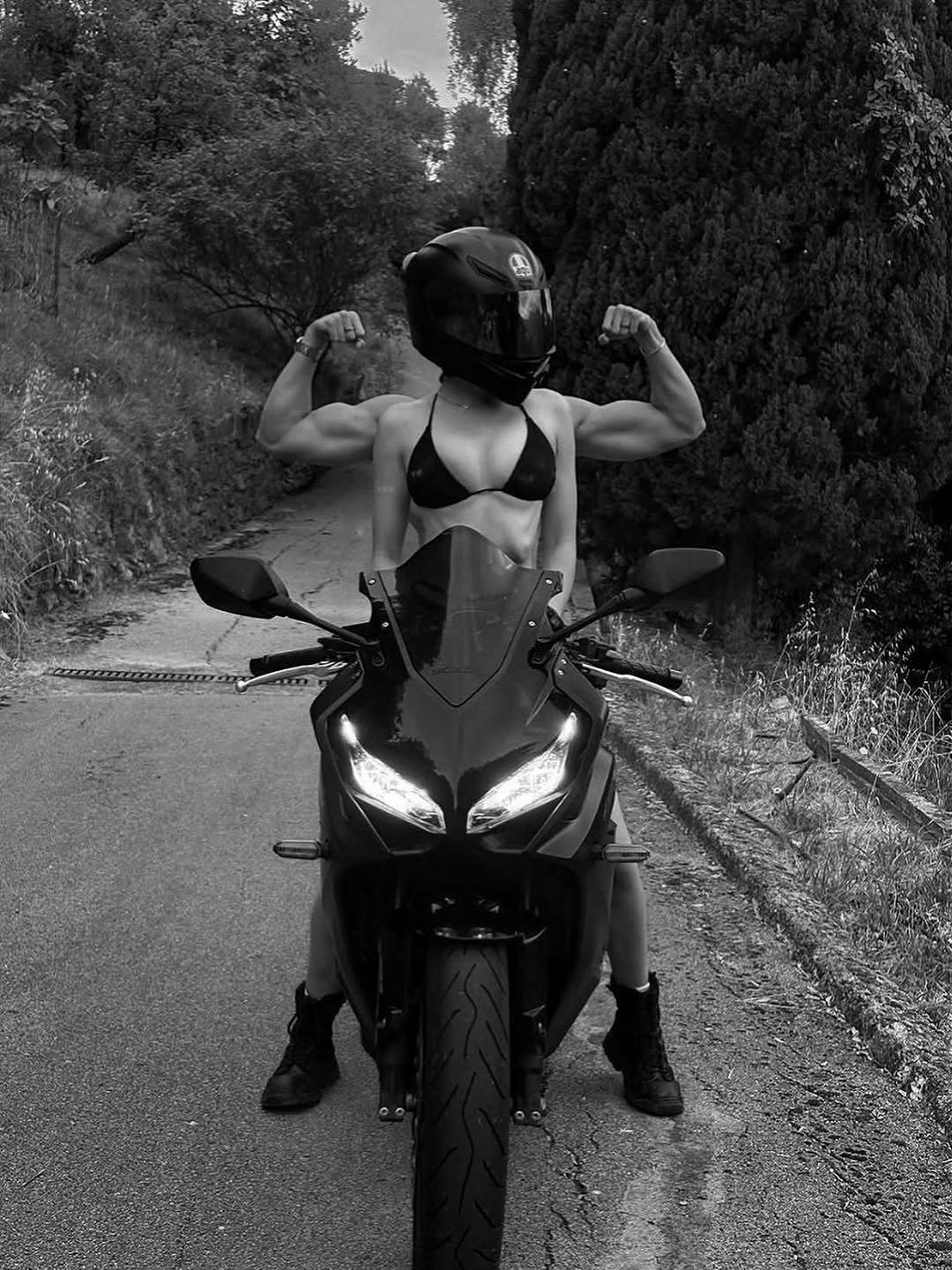 Photo by ❥ on August 12, 2025. May be a black-and-white image of 1 person, motorcycle, helmet, scooter and text.