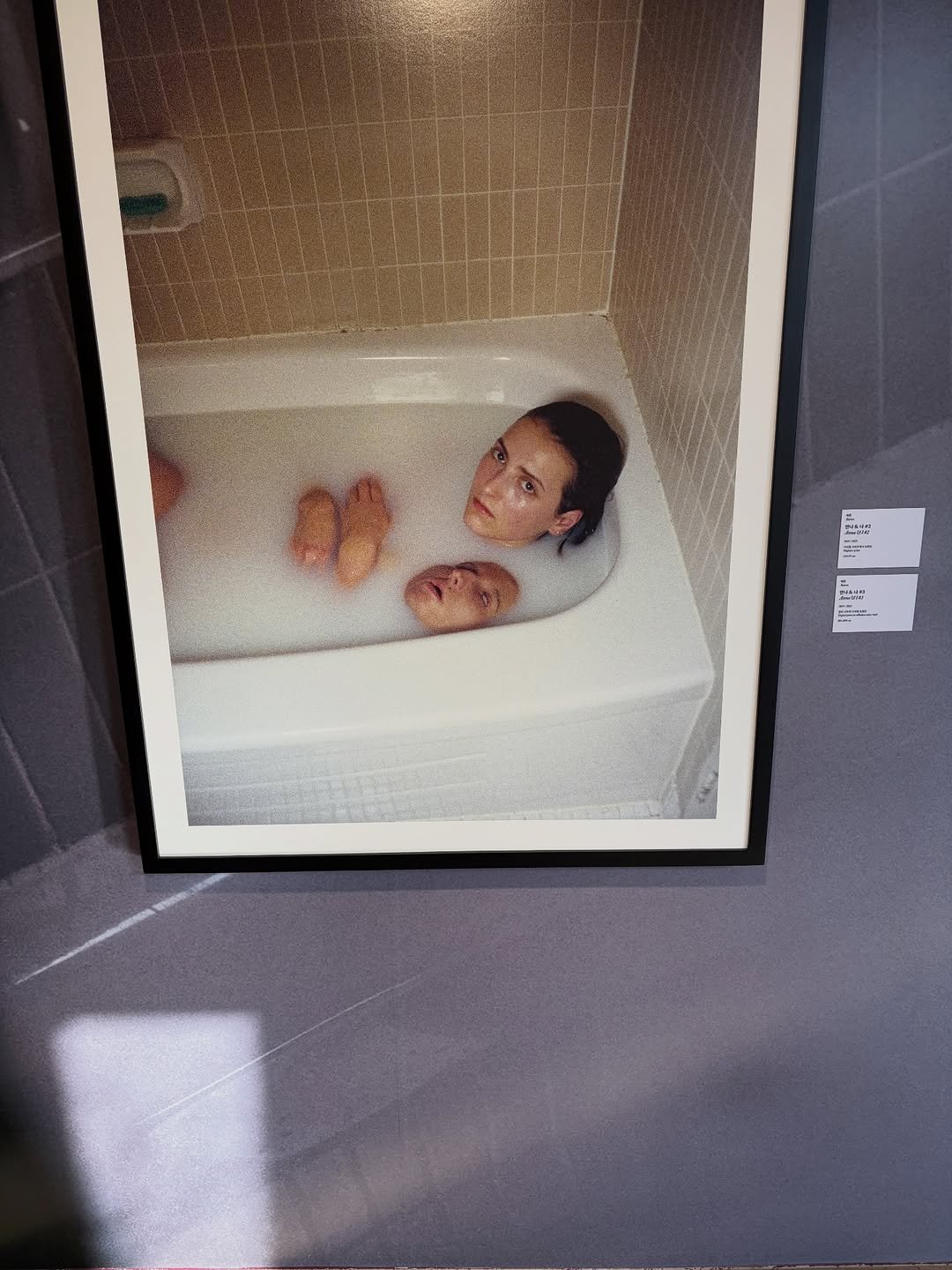 Photo shared by MUGUASU 무과수 on December 30, 2025 tagging @petrafcollins, and @daelimmuseum. May be an image of baby, bathtub, shower and text.