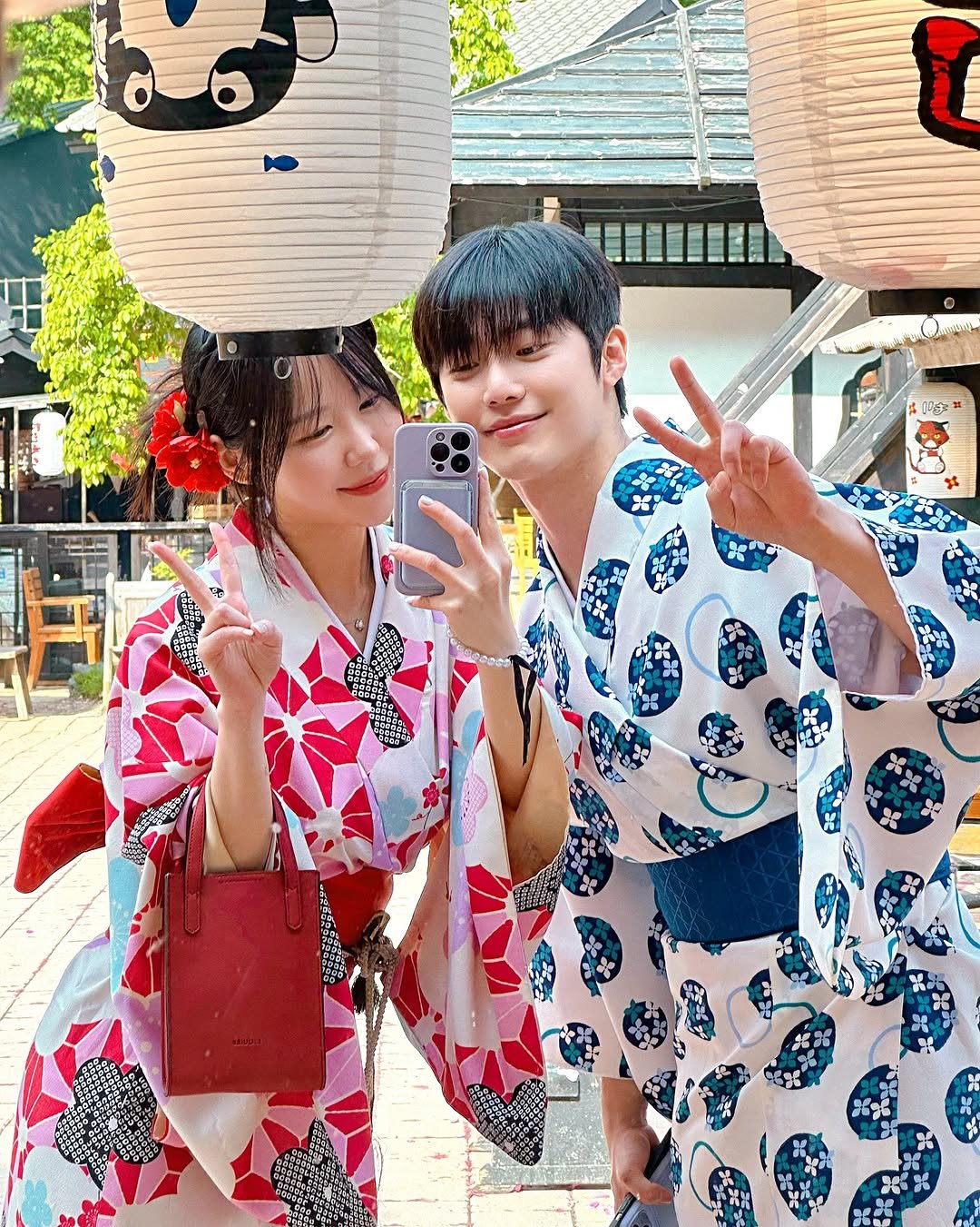 Photo shared by Kim Mumu on June 07, 2025 tagging @wooji_nii. May be an image of one or more people, bath robe, robe, Fushimi Inari Taisha and text.